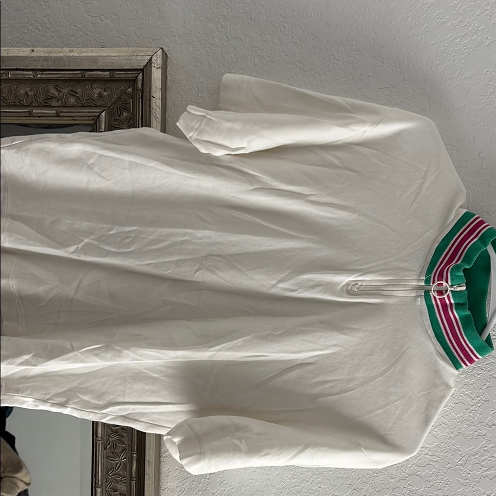 Stylish White Top with Green and Pink Accents